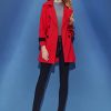 Large lapel cuffs embellish trench coat
